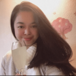 Image of a smiling woman with a long hair