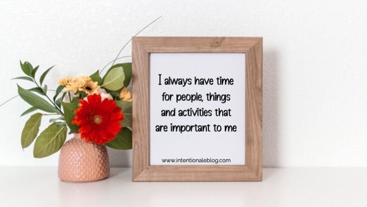 image of a peach vase with flowers beside a frame with productivity affiirmations