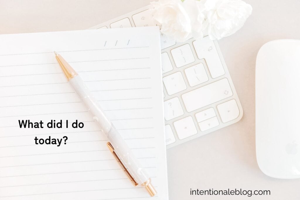 image of a page of a notebook with a gold and white pen.Whole image implies intentional productivity