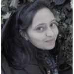 Image of a woman looking at a camera with a sweet smile
